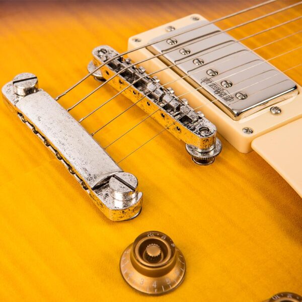 Vintage V100MRTSB ICON Electric Guitar - Distressed Tobacco Sunburst - Tailpiece